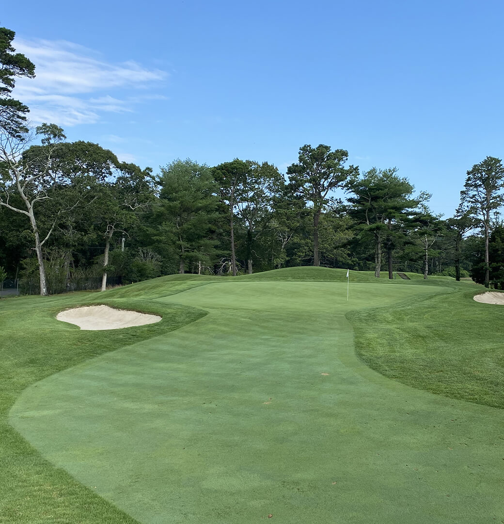 sand traps on either side of golf green